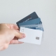 hand holding an array of credit cards